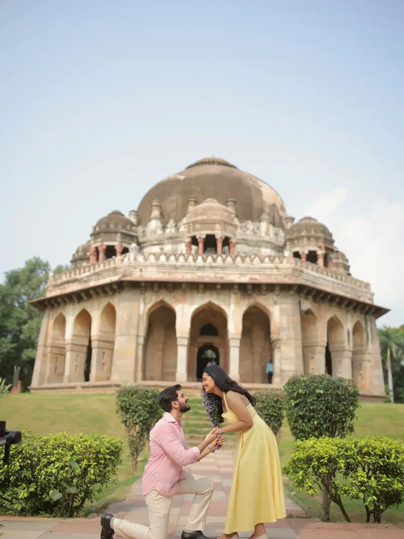 He goes down on one knee in front of a Lodi-era tomb in Lodhi Garden, Delhi